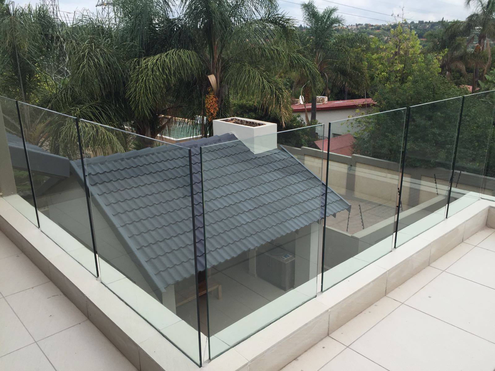 Frameless glass balustrade installed on a rooftop terrace of a Gauteng home