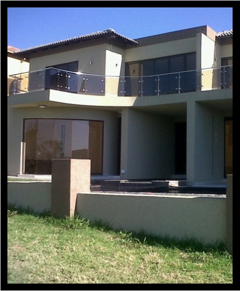 Modern double-storey home with steel and glass balustrade balconies