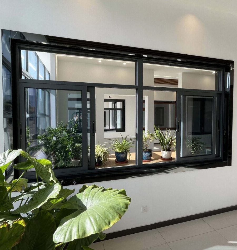 Black-framed aluminium sliding windows installed in a commercial interior
